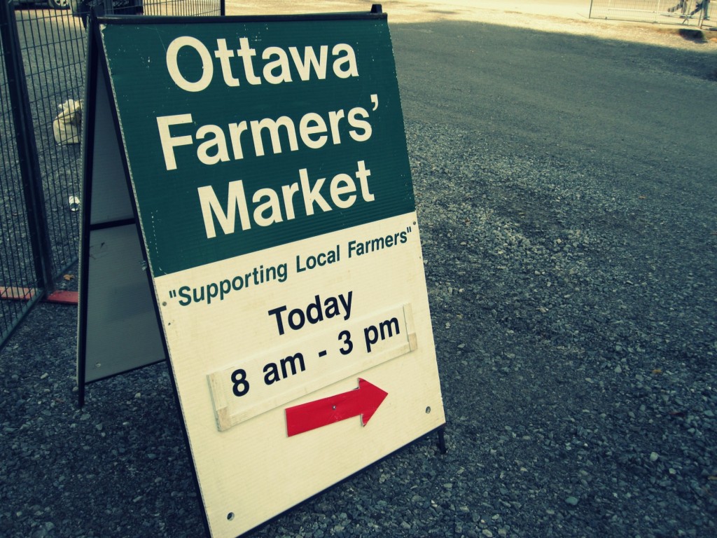 Ottawa Farmers' Market Sign sitting outside of Lansdowne Park to attract visitors.