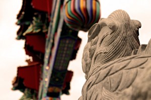 One of the stone lion statues guards the Ottawa Chinatown archway